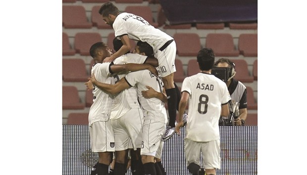 Al Sadd  players celebrate during their match against Al Gharafa.