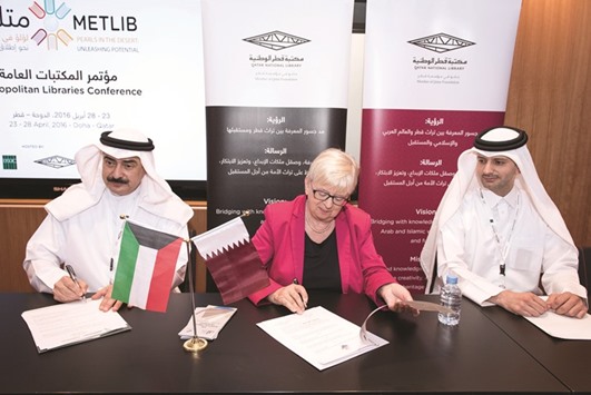 Saadi al-Said, Kamel al-Abduljaleel and Dr Claudia Lux at the signing of the MoU during MetLib 2016 Qatar.