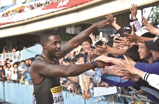 Justin Gatlin of the US meets supporters after winning the 100m event during the Seiko Golden Grand Prix at Todoroki Stadium in Kawasaki yesterday. (AFP)