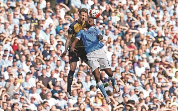 Arsenalu2019s Laurent Koscielny (L) in action with Manchester Cityu2019s Kelechi Iheanacho during their Barclays Premier League at the Etihad Stadium yesterday.