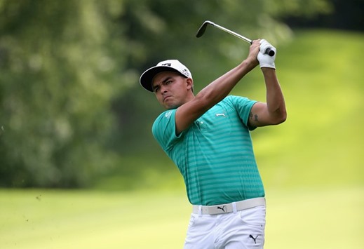 Rickie Fowler watches a shot on the 12th hole during the third round of the 2016 Wells Fargo Championship at Quail Hollow Club in Charlotte on Saturday.