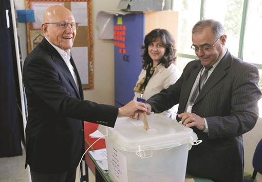 Lebanonu2019s Prime Minister Tammam Salam casts his ballot at a polling station during Beirutu2019s municipal elections yesterday.