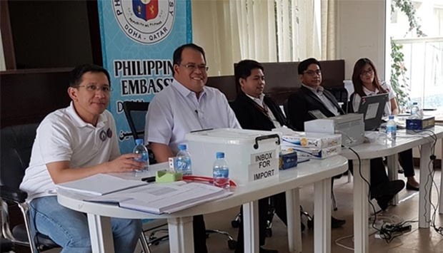 Ambassador Wilfredo Santos and other embassy officials prepares for the official counting of the overseas elections in Qatar yesterday. PICTURE: Joey Aguilar