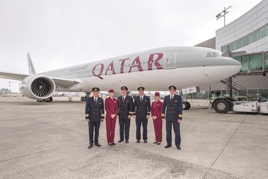 Qatar Airways cockpit and cabin crew with the airlineu2019s 50th Boeing 777. More than 35% of the airlineu2019s route network is operated with Boeing 777s, including both passenger and freighter destinations.