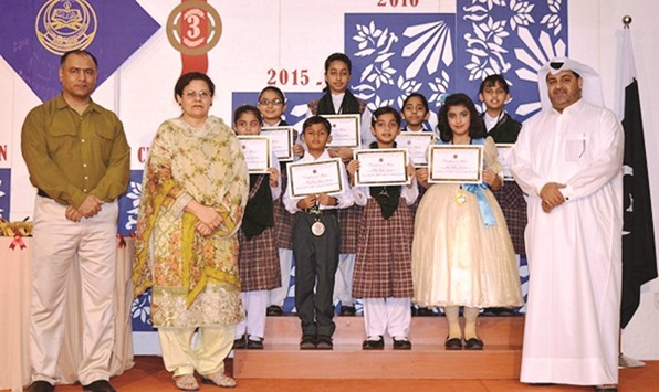 RECOGNITION: Achievers pose with certificates with PEC principal, guests and school officials.
