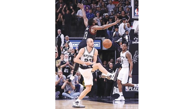 Manu Ginobili of the San Antonio Spurs makes the block against the three-point attempt by Houston Rocketsu2019 James Harden in the final second of play in overtime during Game Five of the Western Conference semi-finals in San Antonio, Texas. (AFP)