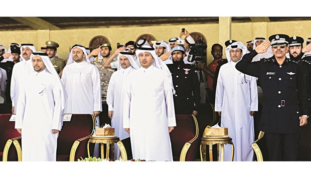 HE the the Prime Minister and Interior Minister Sheikh Abdullah bin Nasser bin Khalifa al-Thani attending the graduation ceremony of the second mandatory qualifying course for graduates of civil universities at the Police College yesterday.