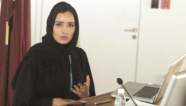 Alya al-Suwaidi speaking at media briefing.