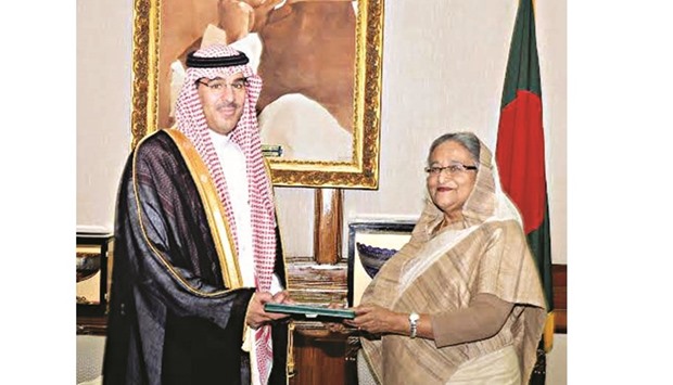 Dr Awad bin Saleh al-Awad handing over an invitation to Prime Minister Sheikh Hasina in Dhaka.