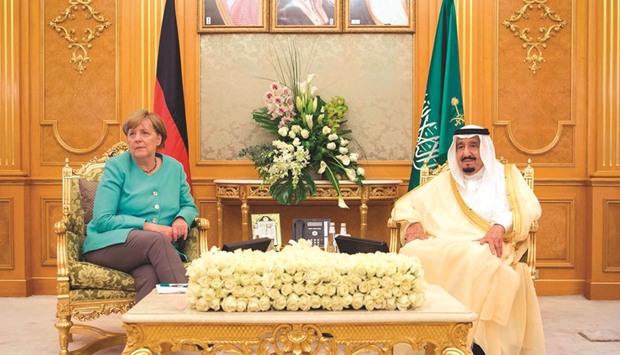 A handout picture provided by the Saudi Royal Palace yesterday, shows German Chancellor Angela Merkel with Saudi Arabiau2019s King Salman during a meeting in Riyadh.