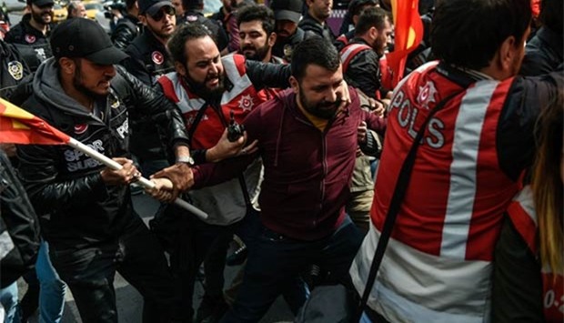 Riot police clash with protesters attempting to defy a ban and march on Taksim Square to celebrate May Day in Istanbul, on Monday.