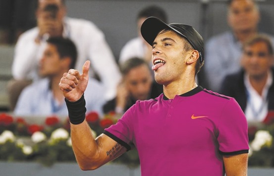 Borna Coric of Croatia celebrates his victory over Andy Murray of Britain at the Madrid Open yesterday. (Reuters)