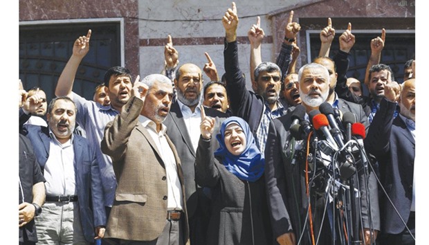 Ismail Haniyah (right) and other Hamas leaders give a press conference in Gaza City yesterday.