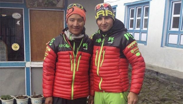 Swiss climber Ueli Steck (right) and sherpa Tenjiing pose for a picture in Lukla.