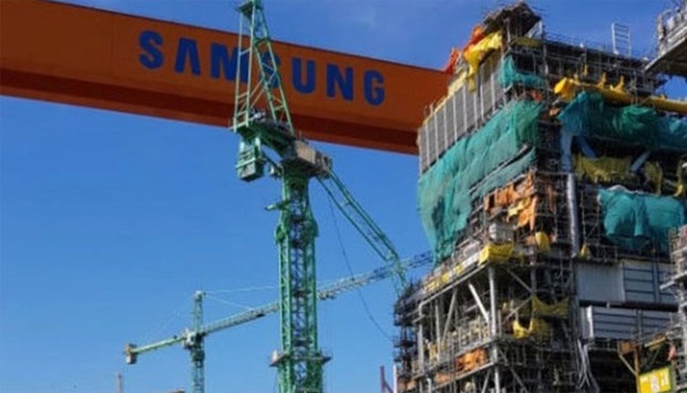 A damaged crane is seen at a Samsung Heavy Industries shipyard in Geoje