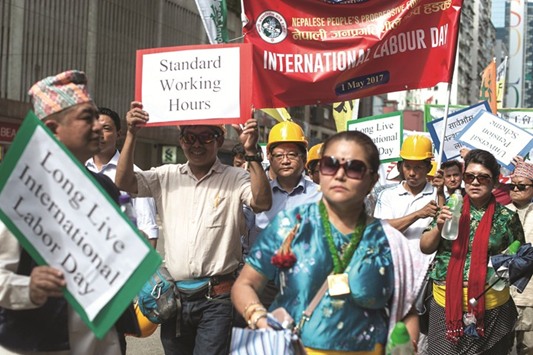 People take part in a May Day protest march in Hong Kong yesterday.