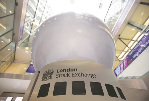 A logo is seen on an interactive sculpture in the main atrium of the London Stock Exchange headquarters. The FTSE 100 closed up 0.7% to 7,435.39 points yesterday.