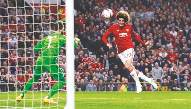 Manchester Unitedu2019s Marouane Fellaini (right) scores his teamu2019s first goal against Celta Vigo in the second leg of their UEFA Europa League semi-final at Old Trafford in Manchester, England, on Thursday. (Reuters)