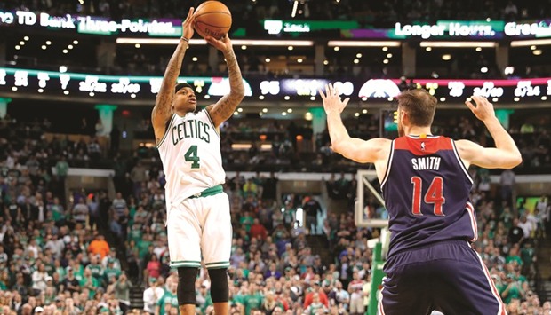 Boston Celtics guard Isaiah Thomas (4) shoots over Washington Wizards forward Jason Smith (14) during the second half of their game against the Washington Wizards  on Sunday. Picture:  Winslow Townson-USA TODAY Sports