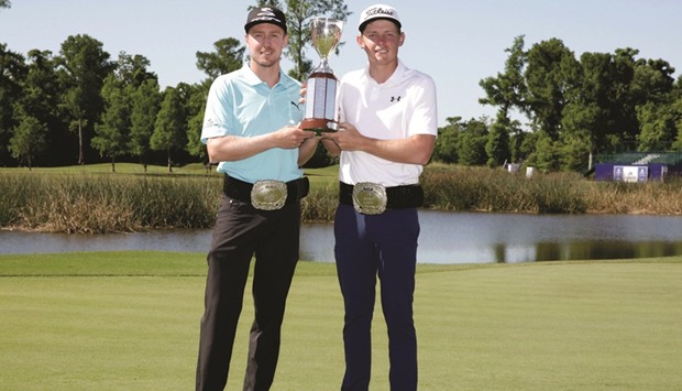 Blixt (left) and Smith with the winnersu2019 trophy. (AFP)