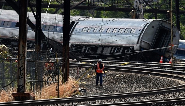 Workers at the scene of an Amtrak train derailment in Philadelphia (file photo)
