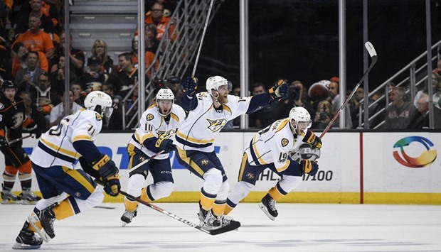 The Nashville Predators celebrate after the game winning goal  against the Anaheim Ducks during overtime.