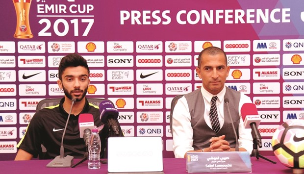 EL Jaish coach Sabri Lamouchi (right) and midfielder Ahmed Moeen attend a press conference.