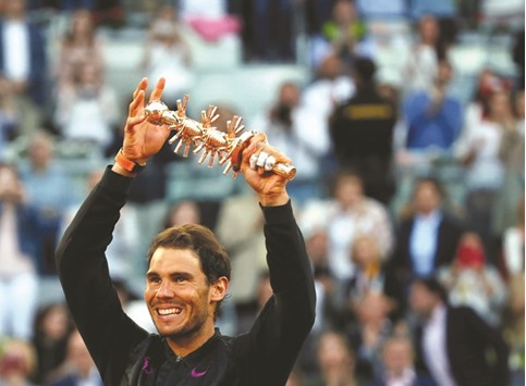 Rafael Nadal celebrates his victory over Dominic Thiem in the Madrid Open final in Madrid yesterday. (AFP)