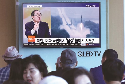 South Koreans watch a news programme showing file footage of a North Korean missile launch at a railway station in Seoul yesterday.