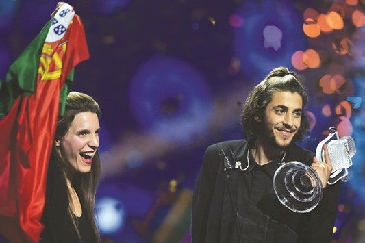 Salvador Sobral holds the trophy as he celebrates with his sister Luisa on stage after winning at the 62nd edition of the Eurovision Song Contest 2017 Grand Final at the International Exhibition Centre in Kiev.