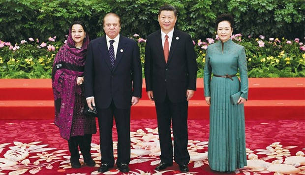 Pakistanu2019s Prime Minister Nawaz Sharif and his wife Kalsoom Nawaz Sharif pose with Chinese President Xi Jinping and his wife Peng Liyuan during a welcome ceremony for leaders attending the Belt and Road Forum, in Beijingu2019s Great Hall of the People yesterday.