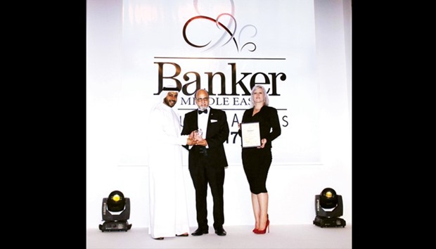 Seetharaman receiving the u2018Best Regional Commercial Banku2019 award for Doha Bank.