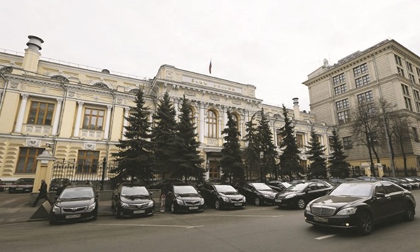 An exterior view of the Russian central bank building in Moscow. Absent from the currency market since 2015, the Bank of Russia will start buying for its international reserves again this year, according to just over half of respondents in a Bloomberg survey of 21 analysts.