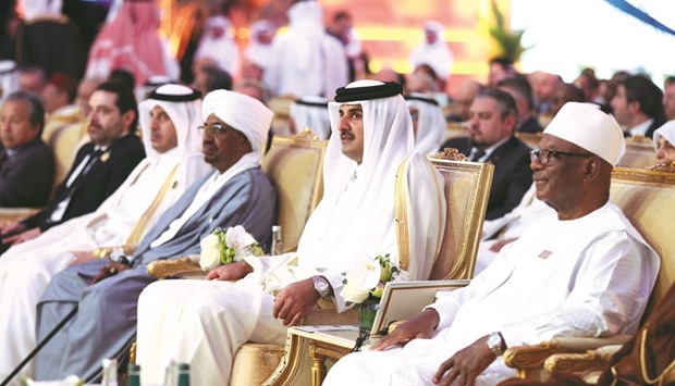 HH the Emir Sheikh Tamim bin Hamad al-Thani and other dignitaries attending  the opening session of the 17th Doha Forum yesterday.
