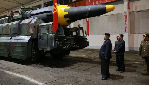 North Korean leader Kim Jong Un inspects the long-range strategic ballistic rocket