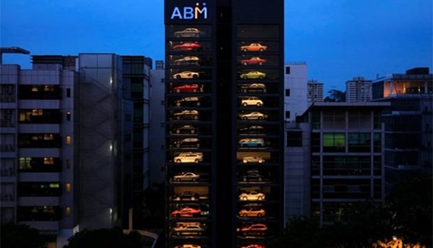 An exotic used car dealership designed to resemble a vending machine is pictured in Singapore. The dealership houses up to 60 exotic cars in a 15-storey building which uses a fish-bone type lift system to deliver cars to clients within minutes.