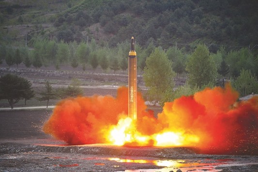 The long-range strategic ballistic rocket Hwasong-12 being launched during a test in this undated photo released yesterday by North Koreau2019s Korean Central News Agency.