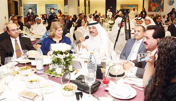 Commercial Bank chairman Sheikh Abdullah bin Ali bin Jabor al-Thani speaks during the luncheon in honour of long-serving bank staff who are retiring this year. CEO Joseph Abraham is also seen.