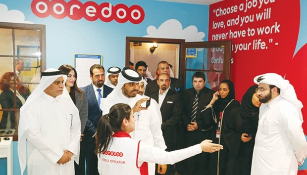 Dignitaries touring the u2018Ooredoo Establishmentu2019.