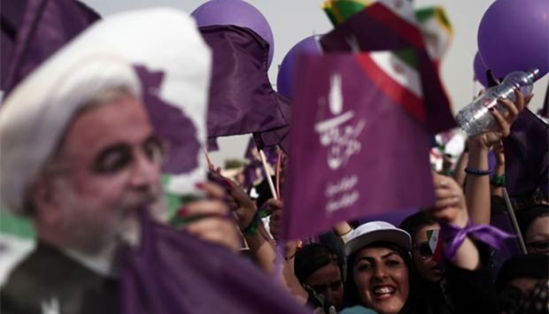 Supporters of Iranian President Hassan Rouhani cheer during a campaign rally in the southwestern city of Ahvaz on Tuesday.