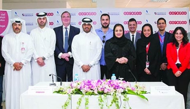 Dr Sheikha Aisha and Sheikh Nasser with other officials at the signing ceremony.