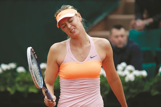 This file photo shows Russiau2019s Maria Sharapova reacting during her French Open match against Australiau2019s Samantha Stosur.
