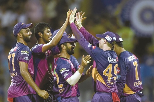 Rising Pune Supergiantu2019s Washington Sundar (second from right) celebrates the dismissal of Mumbai Indians Kieron Pollard with teammates during their Indian Premier League qualifier match in Mumbai yesterday. (AFP)