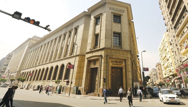 Central Bank of Egyptu2019s headquarters is seen in Cairo. Central bank governor Tarek Amer said yesterday the bank would u201csoonu201d cancel a $100,000 limit on individual bank transfers. The move to ease capital controls is in line with a timeframe set out under an International Monetary Fund programme agreed late last year.