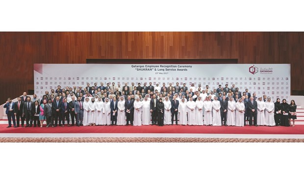 Qatargas chief executive Khalid bin Khalifa al-Thani with senior management and employees.