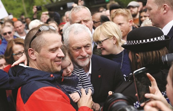 Jeremy Corbyn greets supporters after speaking at a campaign event in Beaumont Park in Huddersfield yesterday.