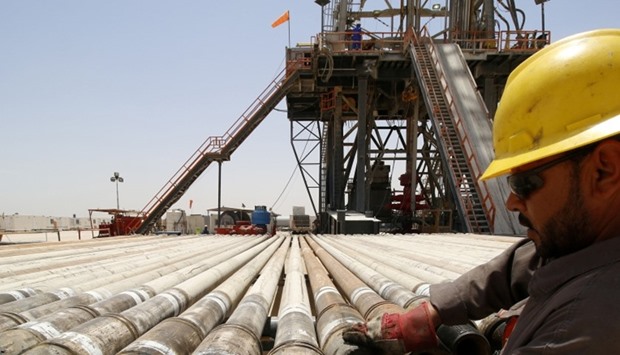 A man works for Iraqi oil company at Rumaila oilfield in Basra