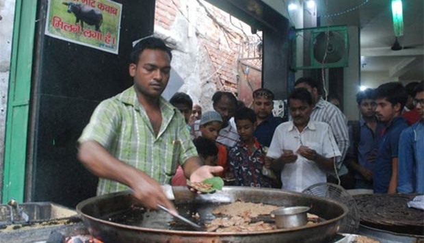 A vendor makes beef kebabs at the Tundey Kebabi restaurant in Lucknow on Wednesday.