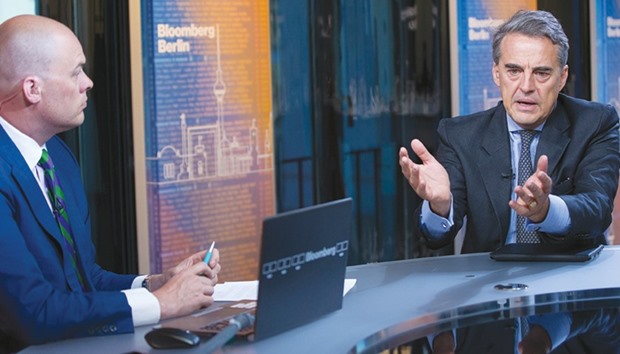 Alexandre de Juniac, director-general and CEO of IATA (right), gestures as he speaks with Matt Miller, an anchor for Bloomberg Television, during an interview in Berlin. Expanding the moratorium on laptops and tablets would cause u201csignificantu201d disruption in the trans-Atlantic business market, and might not be the best way of countering any terrorist threat, Juniac said in an interview yesterday.