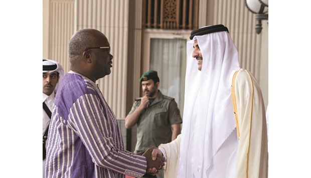 HH the Emir Sheikh Tamim bin Hamad al-Thani shakes hands with Burkina Faso President Roch Marc Christian Kabore before they held a session of official talks at the Emiri Diwan yesterday morning. The two sides discussed bilateral relations and means of boosting them in various fields, especially co-operation in combating terrorism and extremism. A number of issues of common concern were also discussed.